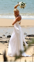 Weddings By Request - Gayle Dean, Marriage Celebrant. Dancing bride on beach.